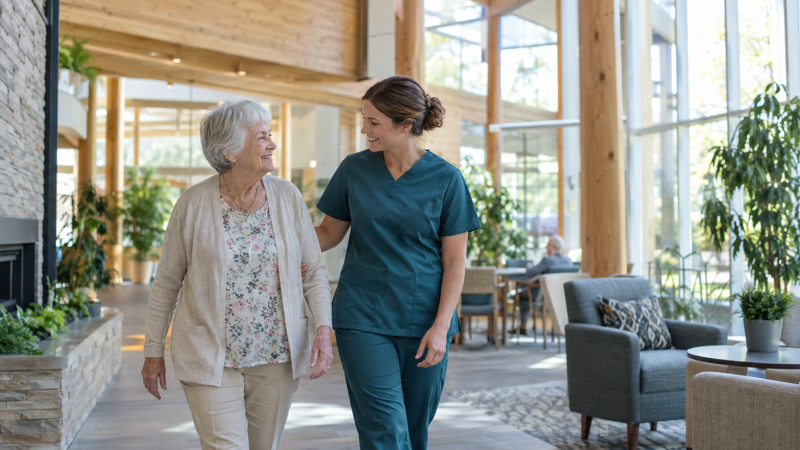 A nurse walking with an older resident through a bright timber and glass atrium